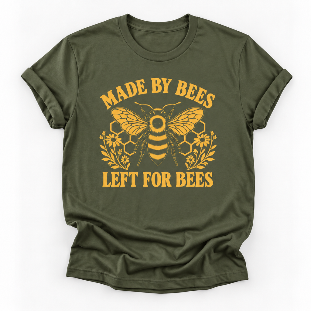 Military green short-sleeve t-shirt with a yellow graphic print featuring a bee, honeycomb, flowers, and the text 'MADE BY BEES LEFT FOR BEES' on a white background.