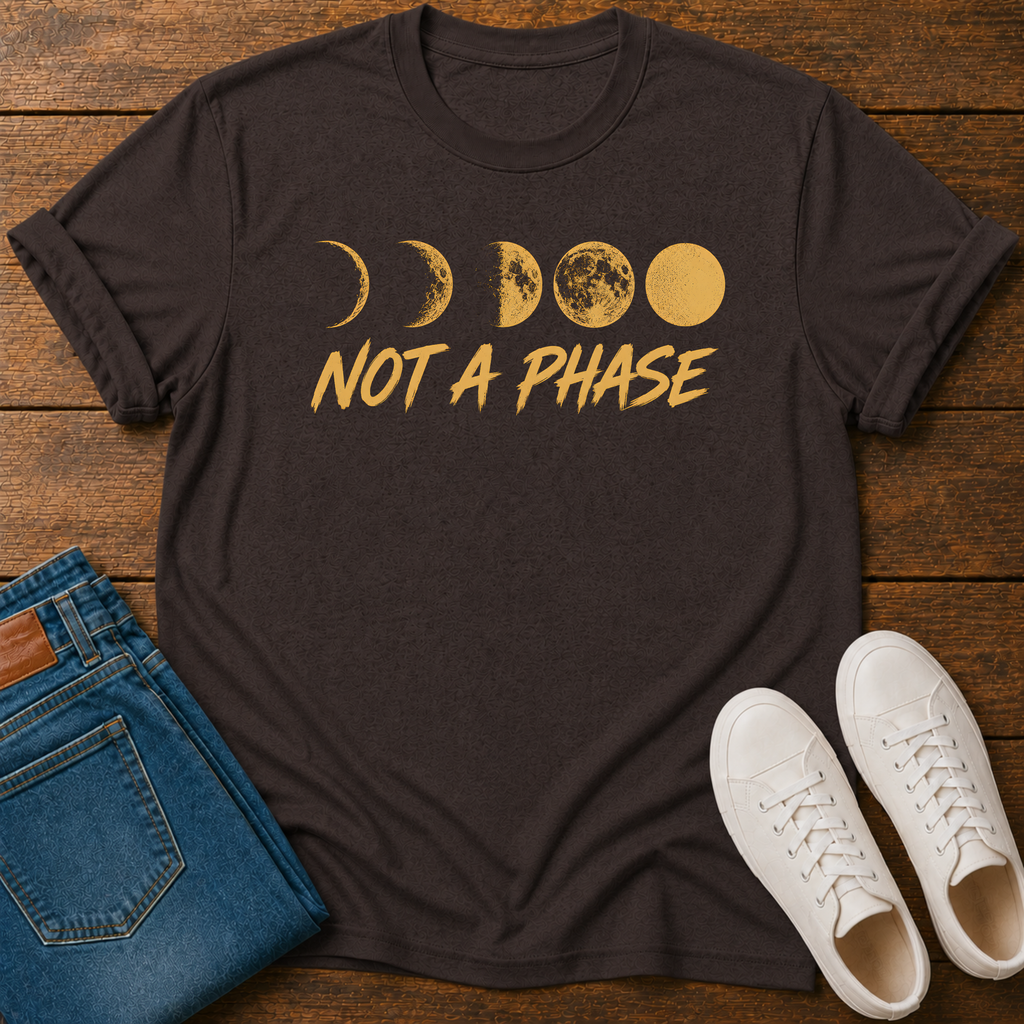 Not A Phase graphic t-shirt design with gold moon phases and bold lettering on a dark background