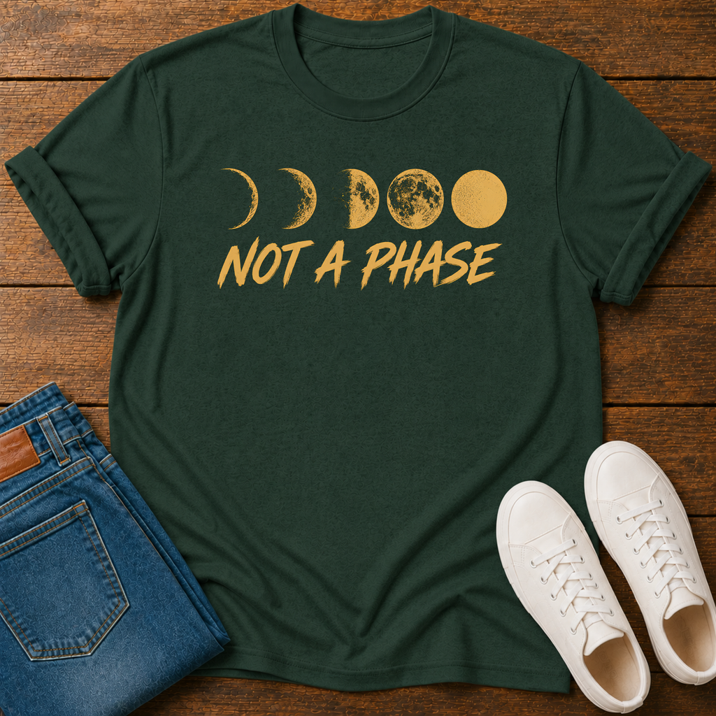Not A Phase graphic t-shirt design with gold moon phases and bold lettering on a dark background