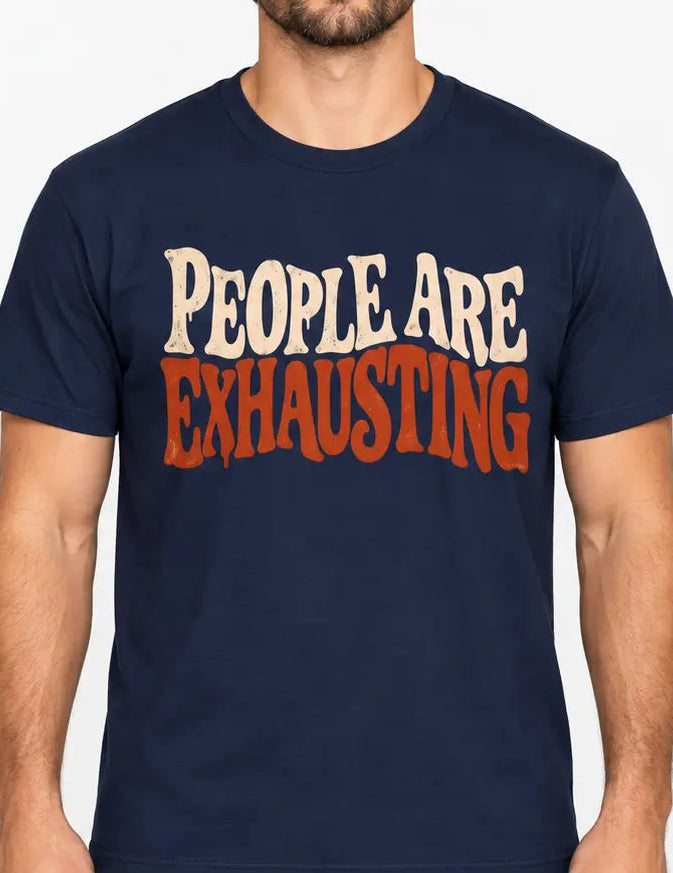 Man wearing a Navy Blue t-shirt with Distressed retro typography design reading “People Are Exhausting” in cream and burnt orange with drooping, tired-looking letterforms.