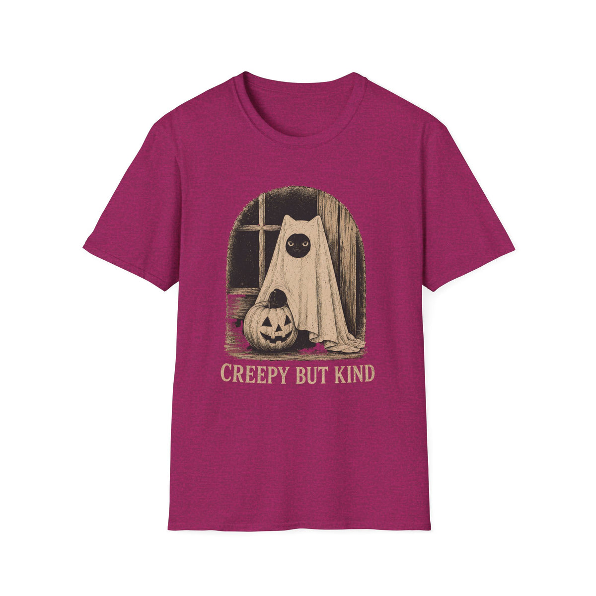 A heather magenta short-sleeve t-shirt with a vintage-style Halloween graphic of a ghostly figure in a sheet next to a jack-o'-lantern, with the text 'CREEPY BUT KIND' printed below.