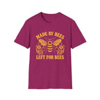 A heather magenta short-sleeve crewneck t-shirt featuring a yellow graphic of a bumblebee with honeycomb patterns and the text 'MADE BY BEES LEFT FOR BEES' printed on the front.