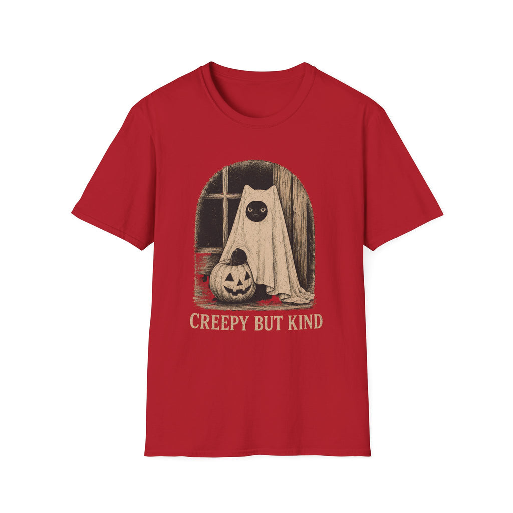 A red short-sleeve crewneck t-shirt featuring a Halloween graphic of a ghostly figure with a pumpkin on a windowsill, with the text 'CREEPY BUT KIND' printed below.
