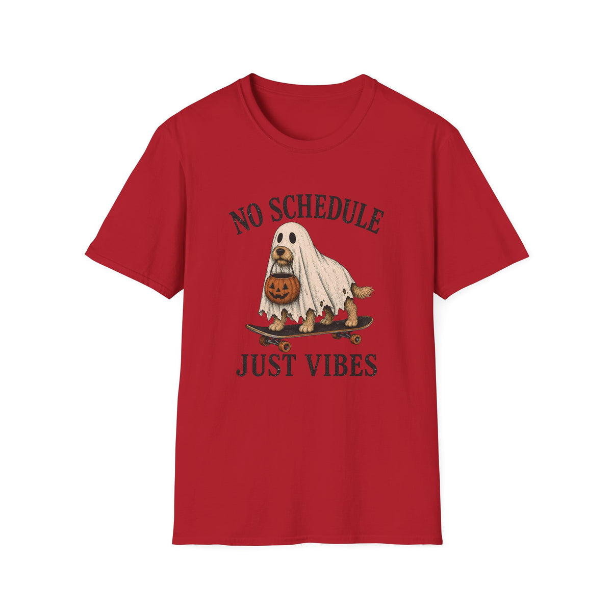 A red short-sleeve crewneck t-shirt featuring a Halloween graphic of a ghost riding a skateboard with a jack-o'-lantern, with the text 'NO SCHEDULE JUST VIBES' printed in black.