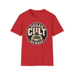 A red short-sleeve crewneck t-shirt featuring a circular graphic on the chest that reads 'VEGAN CULT MEMBER' with a green leaf illustration, shown against a plain white background.