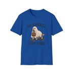 A royal blue short-sleeve crewneck t-shirt featuring a Halloween graphic of a ghost riding a skateboard with a pumpkin, with the text 'NO SCHEDULE JUST VIBES' printed in a distressed dark font.