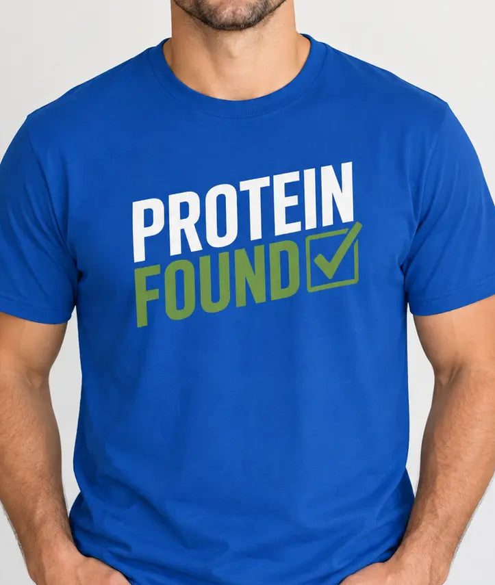 Man wearing a royal blue t-shirt with text 'protein found'