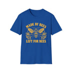 A royal blue short-sleeve crewneck t-shirt featuring a yellow graphic of a bee, honeycomb, and flowers, with the text 'MADE BY BEES LEFT FOR BEES' printed in yellow.