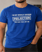 A man wearing a royal blue graphic t-shirt with white text that reads 'I'M NOT MORALLY SUPERIOR PROJECTION YOU SAID THAT, NOT ME'.