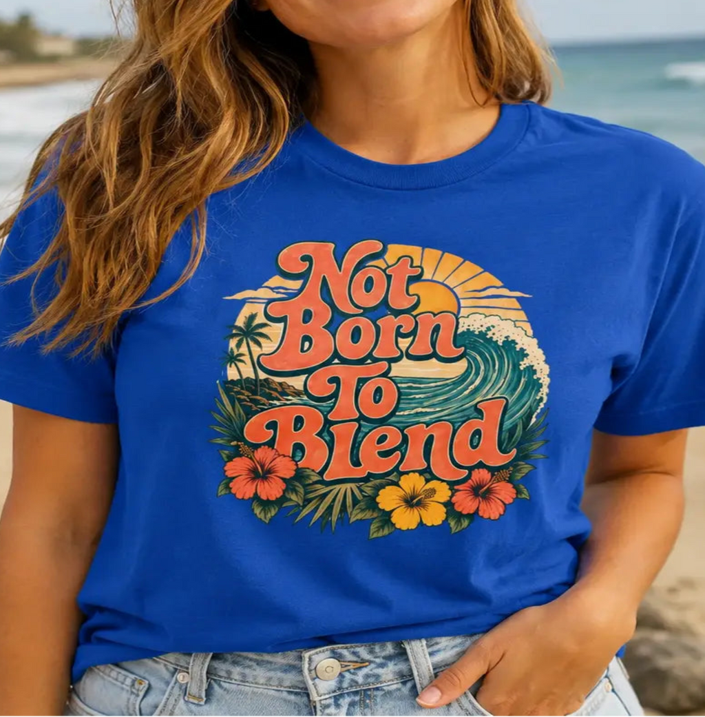 woman wearing a royal blue tee with text 'not born to blend'