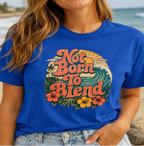 woman wearing a royal blue tee with text 'not born to blend'