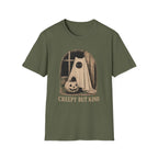 An olive green short-sleeve crewneck t-shirt featuring a vintage-style Halloween graphic of a ghostly figure with a pumpkin, with the text 'CREEPY BUT KIND' printed below.