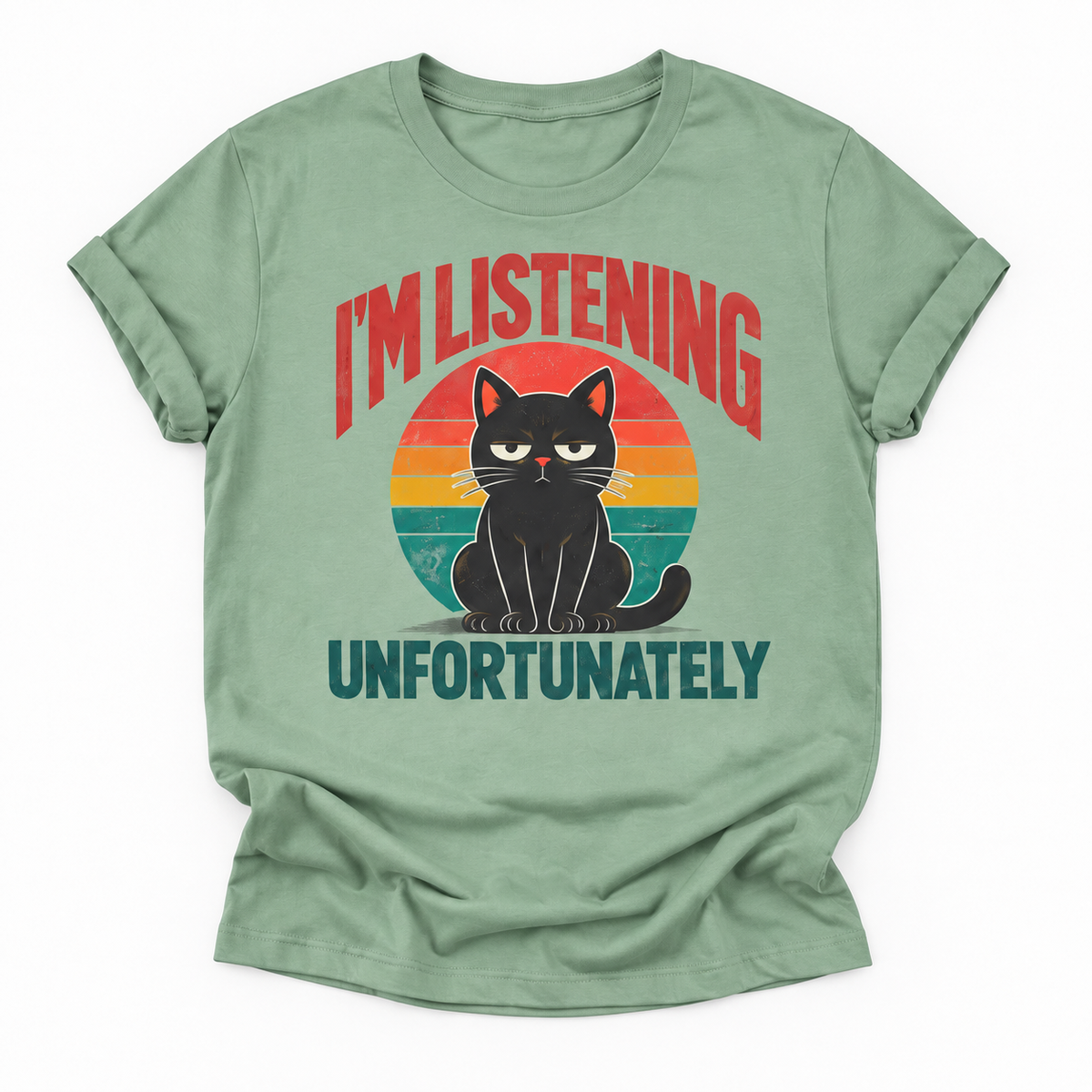 A sage green short-sleeve t-shirt with a retro graphic of a grumpy black cat in front of a multi-colored sunset circle, with the text 'I'M LISTENING UNFORTUNATELY' printed on the front.