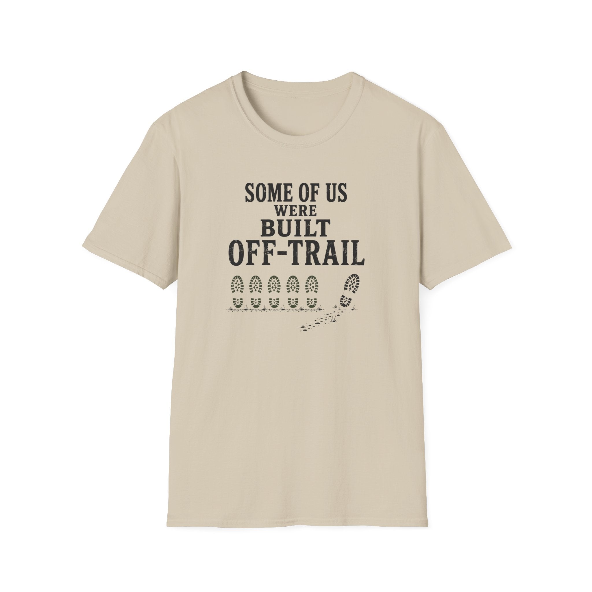 A light beige crewneck t-shirt with a black graphic print on the front that reads 'SOME OF US WERE BUILT OFF-TRAIL' above a trail footprint graphic, shown on a plain white background.