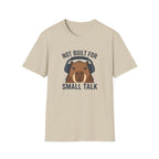 Sand t-shirt with image of a capybara wearing headphones and text 'not built for small talk'