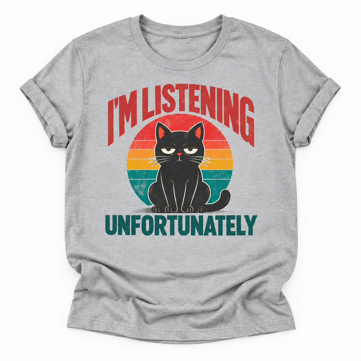 A heather gray short-sleeve t-shirt with a retro-style graphic of a black cat sitting in front of a colorful sunset circle. The text reads 'I'M LISTENING UNFORTUNATELY' in red and teal lettering.