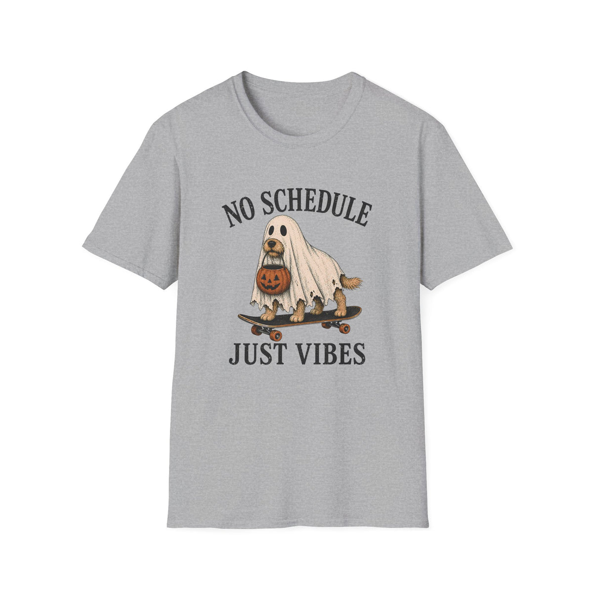 A light gray short-sleeve crewneck t-shirt featuring a Halloween graphic of a dog dressed as a ghost on a skateboard with a pumpkin, with the text 'NO SCHEDULE JUST VIBES' printed in black.