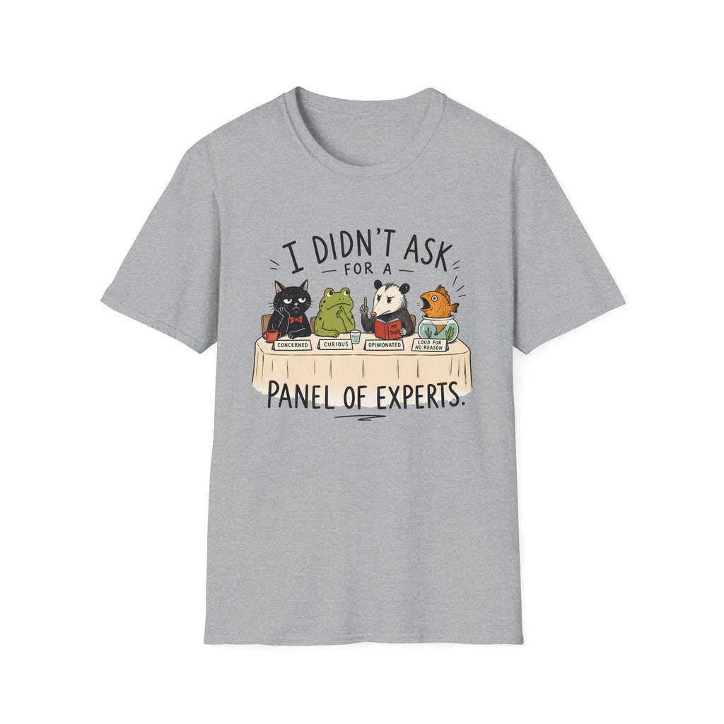 A light heather gray short-sleeve crewneck t-shirt featuring a cartoon graphic of five animals (a black cat, green frog, panda, orange cat, and mouse) sitting at a table with books, with the text 'I DIDN'T ASK FOR A PANEL OF EXPERTS.' printed above and below.