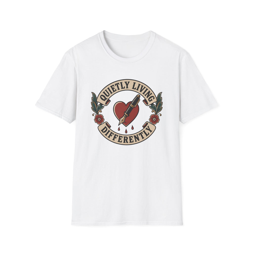 A white short-sleeve crewneck t-shirt featuring a vintage-style tattoo graphic on the chest. The graphic depicts a red heart pierced by a needle, with banners reading 'QUIETLY LIVING' and 'DIFFERENTLY' flanked by green leaves and red roses.