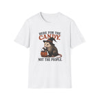 A white short-sleeve crewneck t-shirt featuring a Halloween graphic of an opossum wearing a witch hat and holding a jack-o'-lantern, with the text 'HERE FOR THE CANDY. NOT THE PEOPLE.