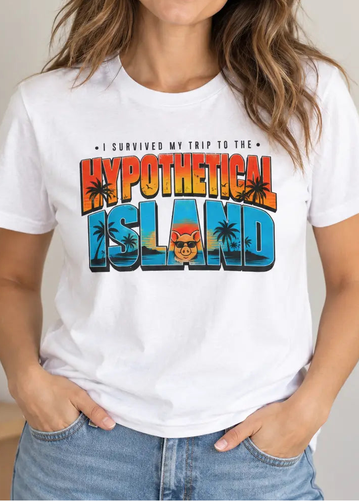 A woman wearing a white graphic t-shirt with a colorful retro-style 'Hypothetical Island' design, paired with blue jeans in a brightly lit indoor setting.