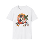 A white short-sleeve crewneck t-shirt featuring a colorful graphic print of a cow lounging in an orange armchair against a sunset background.