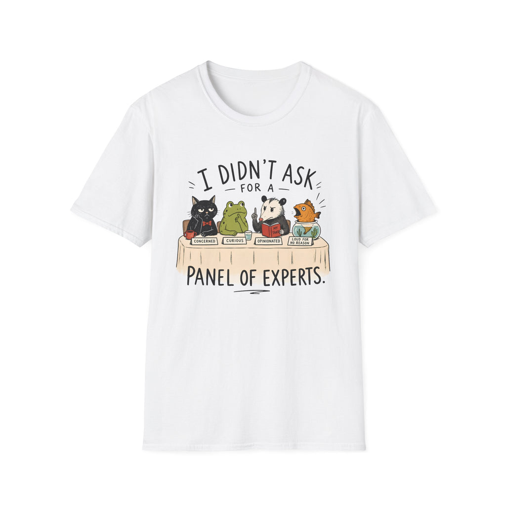 A white short-sleeve crewneck t-shirt featuring a cartoon graphic of four animals (a black cat, a green frog, a panda, and an orange cat) sitting at a table with books, with the text 'I DIDN'T ASK FOR A PANEL OF EXPERTS.' printed above and below.