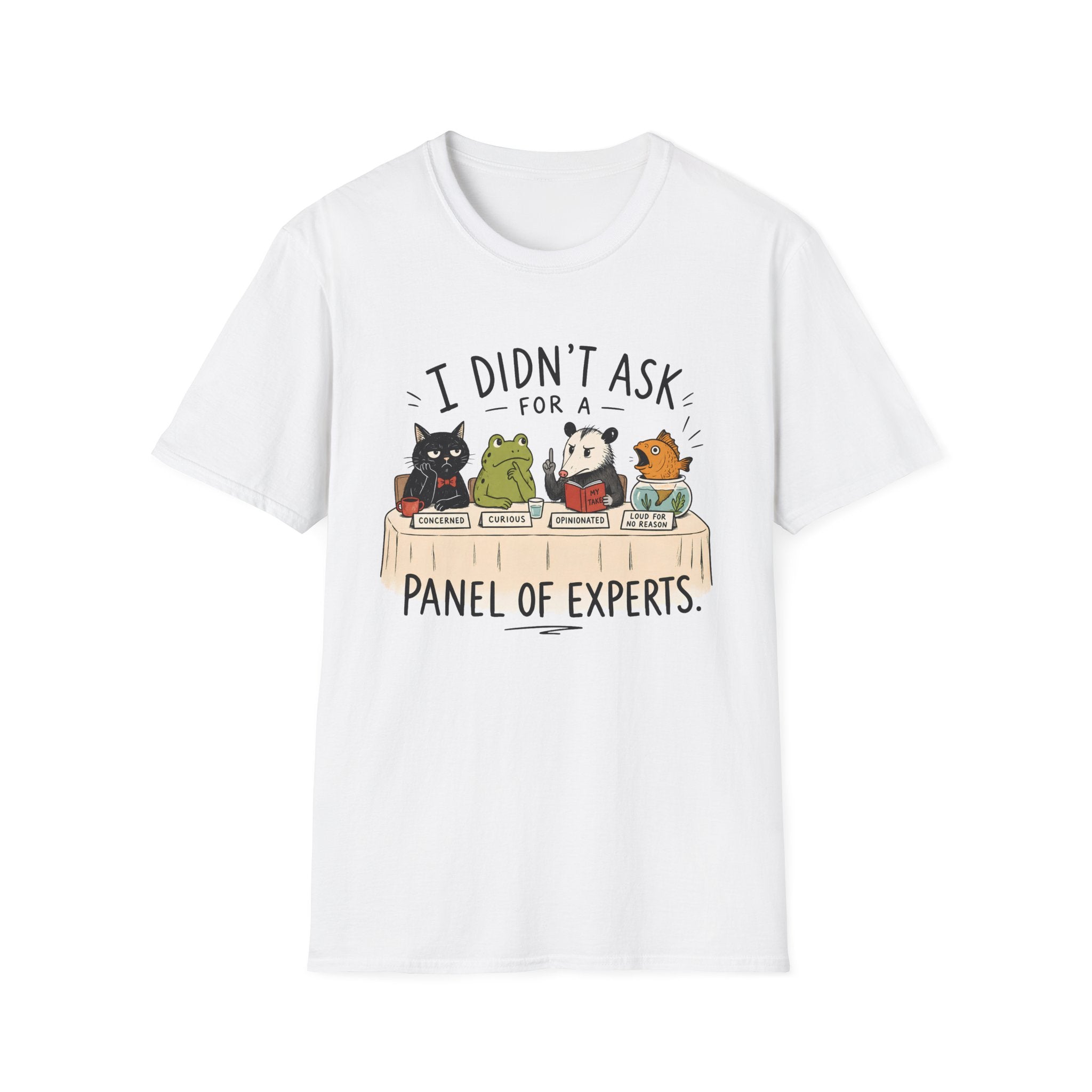 A white short-sleeve crewneck t-shirt featuring a cartoon graphic of four animals (a black cat, a green frog, a panda, and an orange cat) sitting at a table with books, with the text 'I DIDN'T ASK FOR A PANEL OF EXPERTS.' printed above and below.