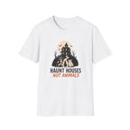 A white short-sleeve crewneck t-shirt with a graphic on the chest showing a haunted house, bats, and dogs under a full moon, with the text 'HAUNT HOUSES NOT ANIMALS' in black and orange lettering.