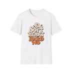 A white short-sleeve crewneck t-shirt featuring a retro-style graphic on the chest that reads 'SOFT HEART HARD NO' in beige and orange lettering, decorated with a small daisy flower.