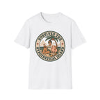 A white short-sleeve crewneck t-shirt featuring a circular retro-style graphic on the chest with the text 'SURVIVED THE HYPOTHETICAL ISLAND' and an illustration of a woman and child under a palm tree.