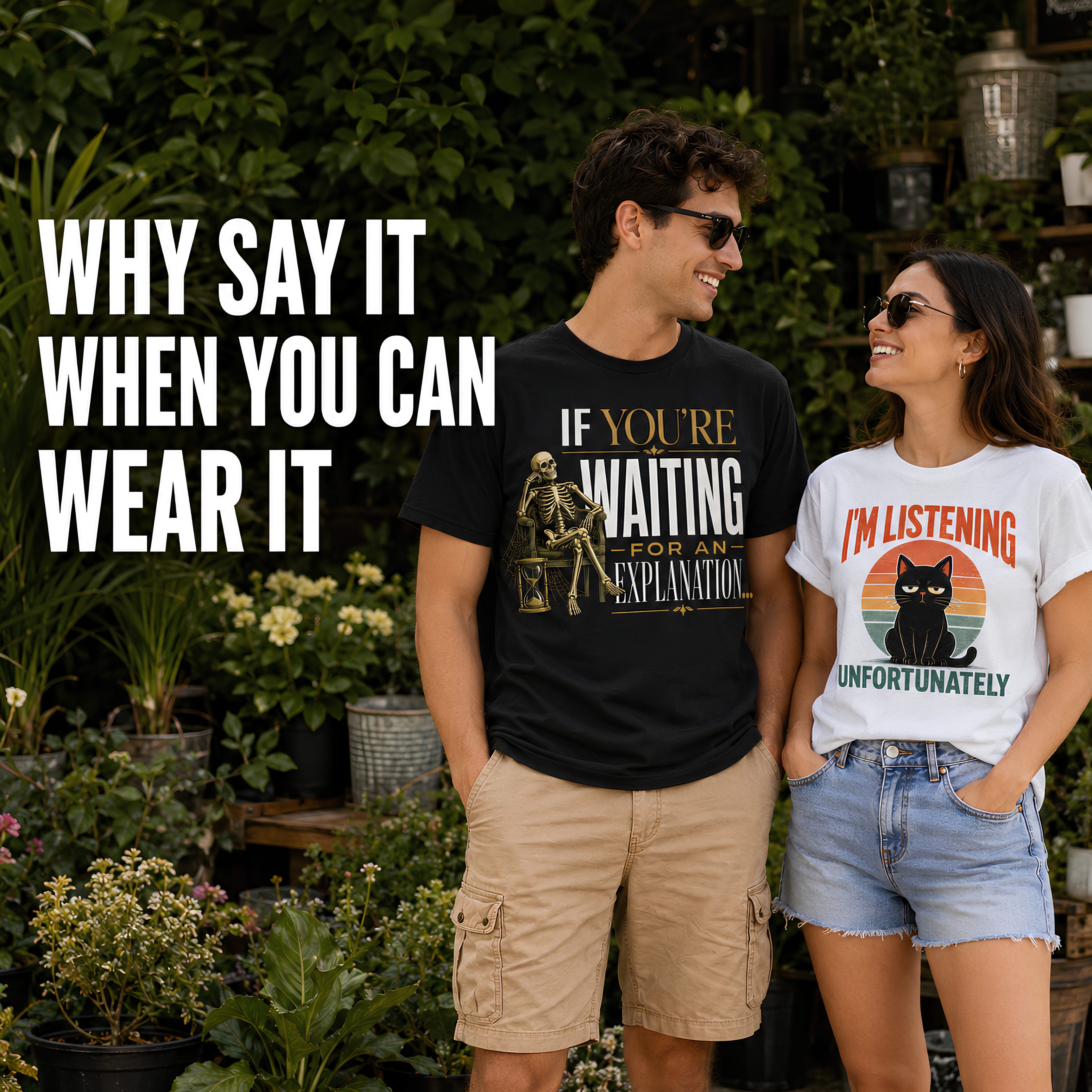 A man and a woman standing outdoors in a garden setting, wearing graphic t-shirts. The man wears a black t-shirt with a gold skeleton and the text 'IF YOU'RE WAITING FOR EXPLANATION'.
