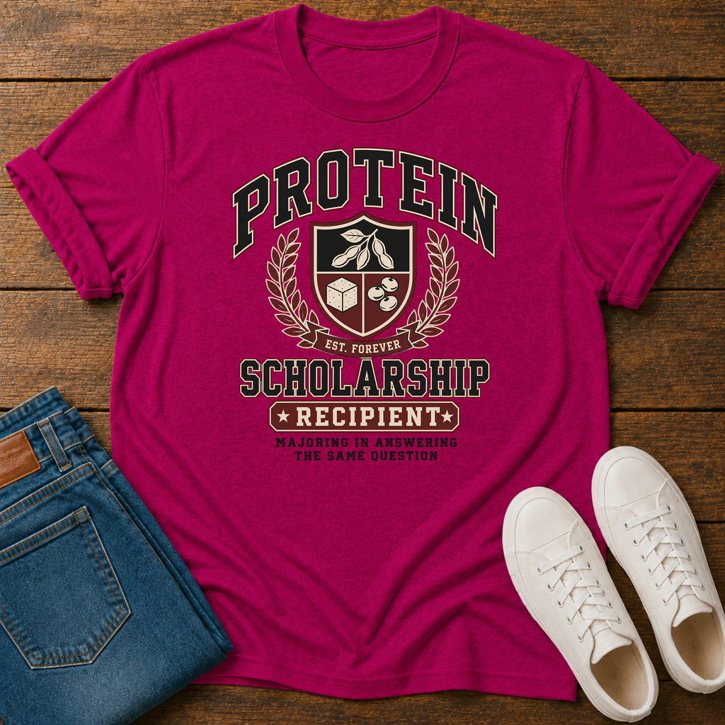 hot pink  t-shirt with Vintage collegiate crest design reading “Protein Scholarship Recipient” with soybean, tofu, and bean illustrations and the words “Majoring in Answering the Same Question.”