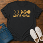 Not A Phase graphic t-shirt design with gold moon phases and bold lettering on a dark background