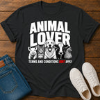 Black t-shirt with animal lover graphic on a wooden surface with jeans and shoes.