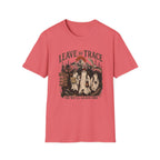 A coral pink short-sleeve t-shirt with a vintage-style Halloween graphic on the chest. The graphic features three ghosts, a graveyard, a tree, and the text 'LEAVE NO TRACE OR WE'LL LEAVE ONE'.