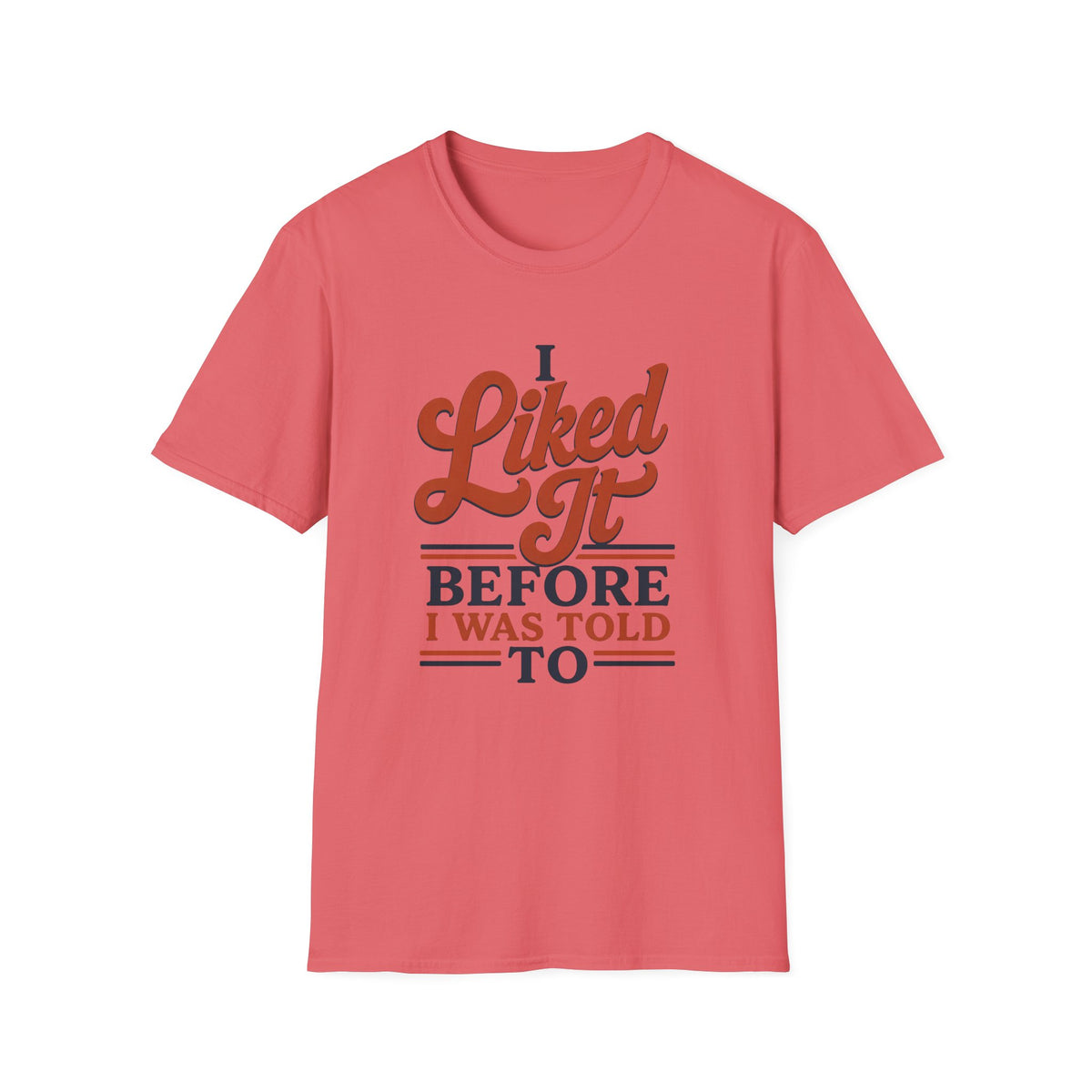 A coral pink short-sleeve crewneck t-shirt with a retro-style graphic on the chest that reads 'I Liked It BEFORE I WAS TOLD TO' in brown and navy blue lettering, displayed on a clean white background.