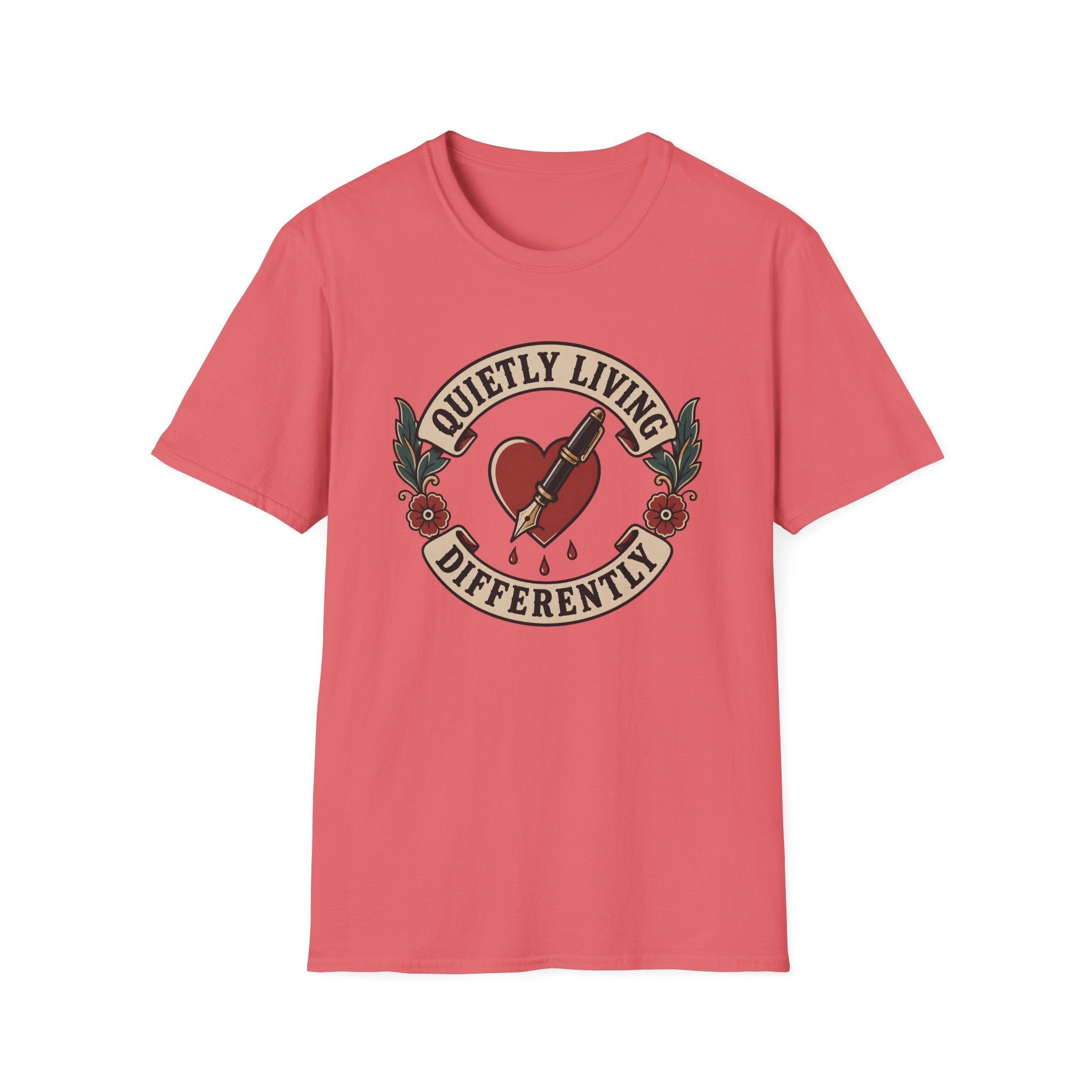 A coral pink short-sleeve crewneck t-shirt featuring a vintage-style tattoo graphic on the chest. The graphic depicts a red heart pierced by a syringe, with green leaves and the text 'QUIETLY LIVING DIFFERENTLY' arched above and below.