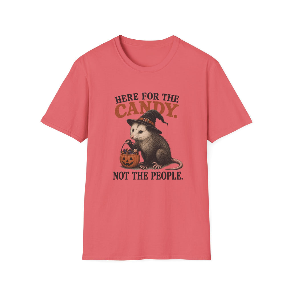 A coral pink short-sleeve t-shirt with a Halloween graphic of an opossum wearing a witch hat and holding a candy corn, with the text 'HERE FOR THE CANDY. NOT THE PEOPLE.
