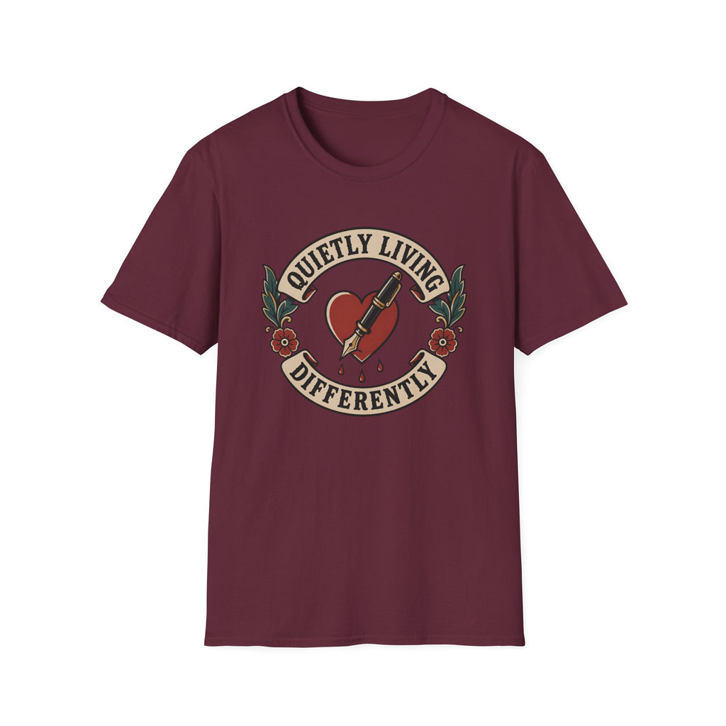 Traditional tattoo-inspired design featuring a heart pierced by a fountain pen with the words "Quietly Living Differently."