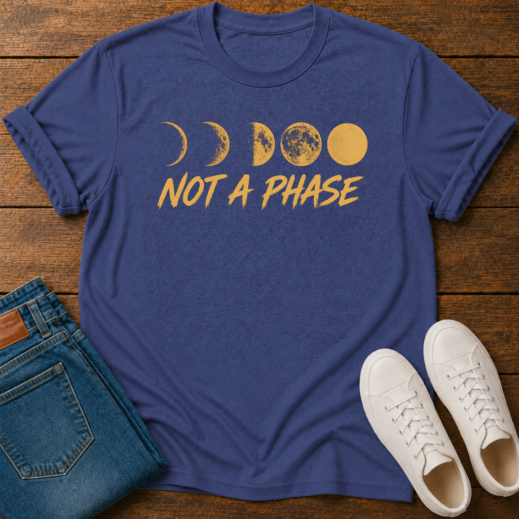 Not A Phase graphic t-shirt design with gold moon phases and bold lettering on a dark background