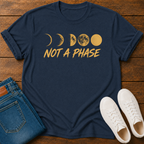 Not A Phase graphic t-shirt design with gold moon phases and bold lettering on a dark background
