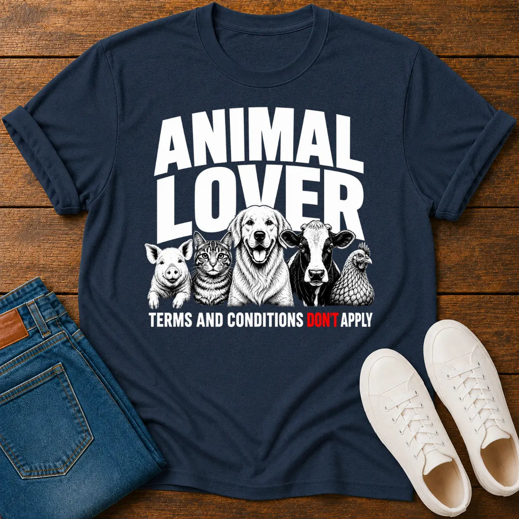 Navy blue t-shirt with 'Animal Lover' graphic on a wooden surface with jeans and shoes.