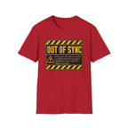 A red short-sleeve crewneck t-shirt featuring a yellow and black 'OUT OF SYNC' warning label graphic printed on the chest, displayed against a solid white background.