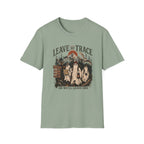 A sage green short-sleeve crewneck t-shirt with a vintage-style Halloween graphic on the front. The graphic features three ghosts in white sheets, a full moon, and the text 'LEAVE NO TRACE' and 'OR WE'LL LEAVE ONE'.