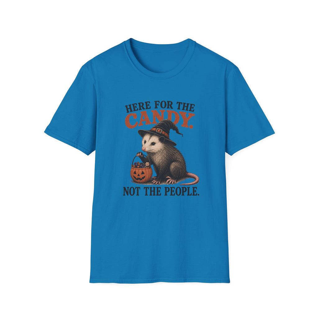 A bright blue short-sleeve crewneck t-shirt featuring a Halloween graphic of an opossum in a witch hat holding a jack-o'-lantern candy basket, with the text 'HERE FOR THE CANDY. NOT THE PEOPLE.