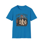 A bright blue short-sleeve crewneck t-shirt with a vintage-style Halloween graphic on the chest. The graphic features three ghosts, a signpost, a snake, and the text 'LEAVE NO TRACE' and 'OR WE'LL LEAVE ONE'.