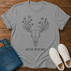 Sports grey t-shirt with image of a skull and flowers with text 'just here for the grass'