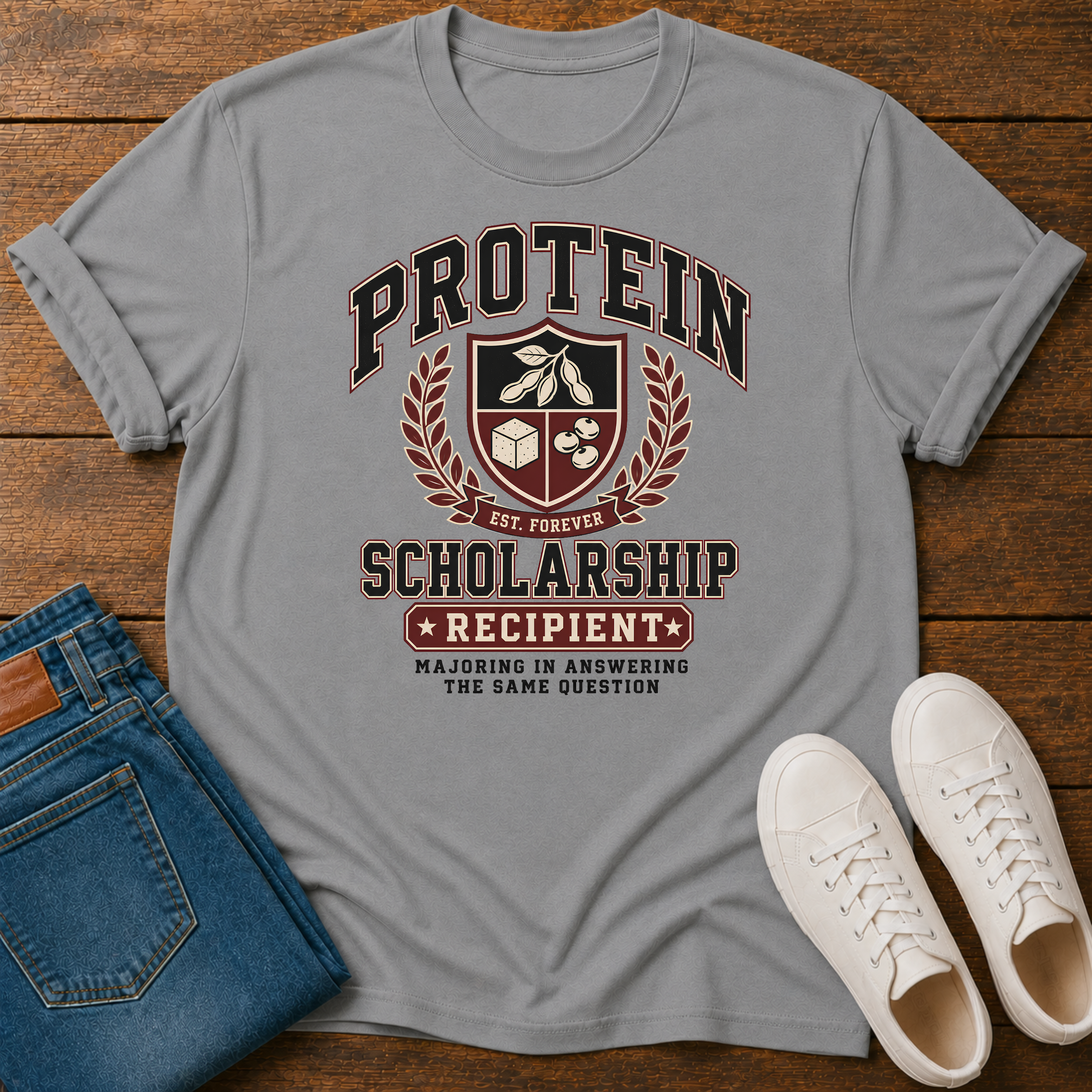 Vintage collegiate crest design reading “Protein Scholarship Recipient” with soybean, tofu, and bean illustrations and the words “Majoring in Answering the Same Question.”