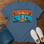 A blue graphic t-shirt laid flat on a wooden surface, styled with folded blue jeans and white sneakers. The t-shirt features a colorful retro-style graphic reading 'I SURVIVED MY TRIP TO THE HYPOTHETICAL ISLAND' with palm trees and a cartoon face.